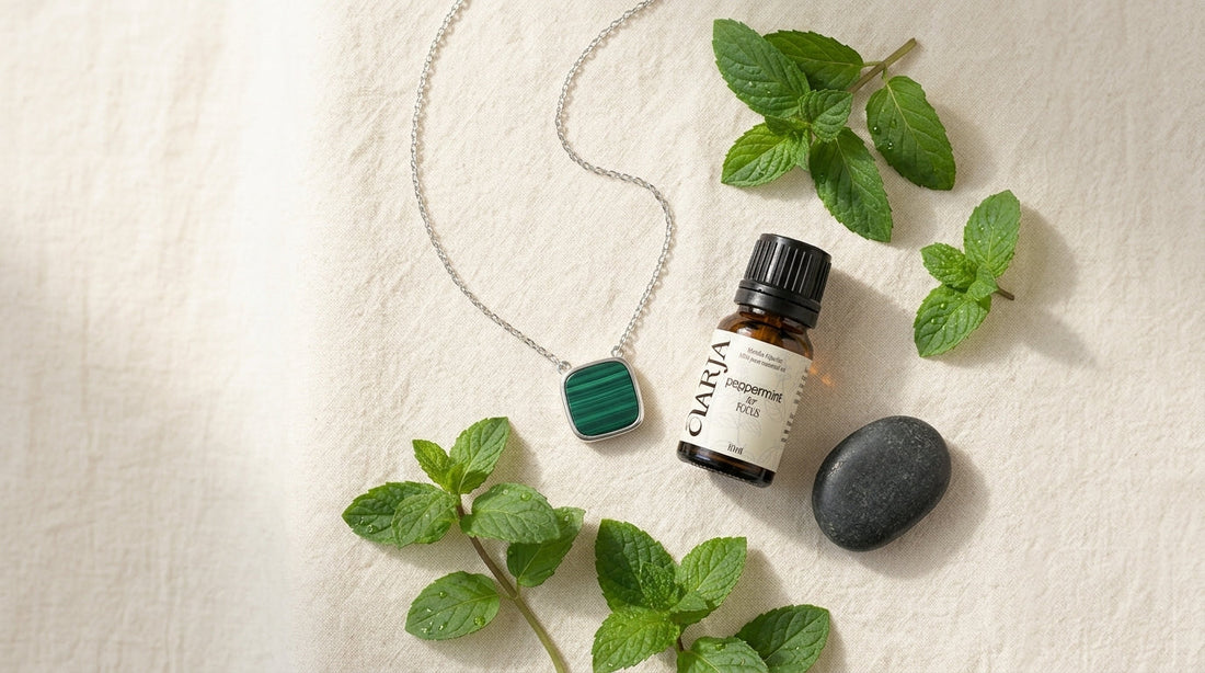 ĀARJA malachite square necklace with Focus peppermint essential oil on ivory linen — best aromatherapy jewelry Hong Kong guide