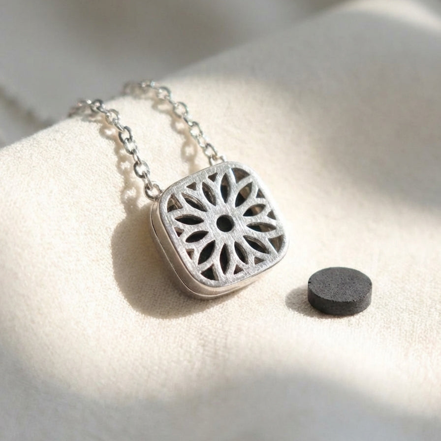 Flower motif on the back of pendant, porous stone for aromatherapy